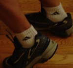 persons feet and shoes that are in motion